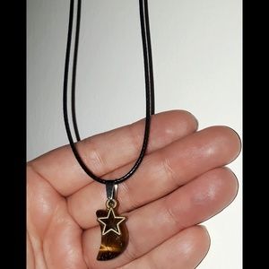 Tigers eye moon pendant with star on 18in cord